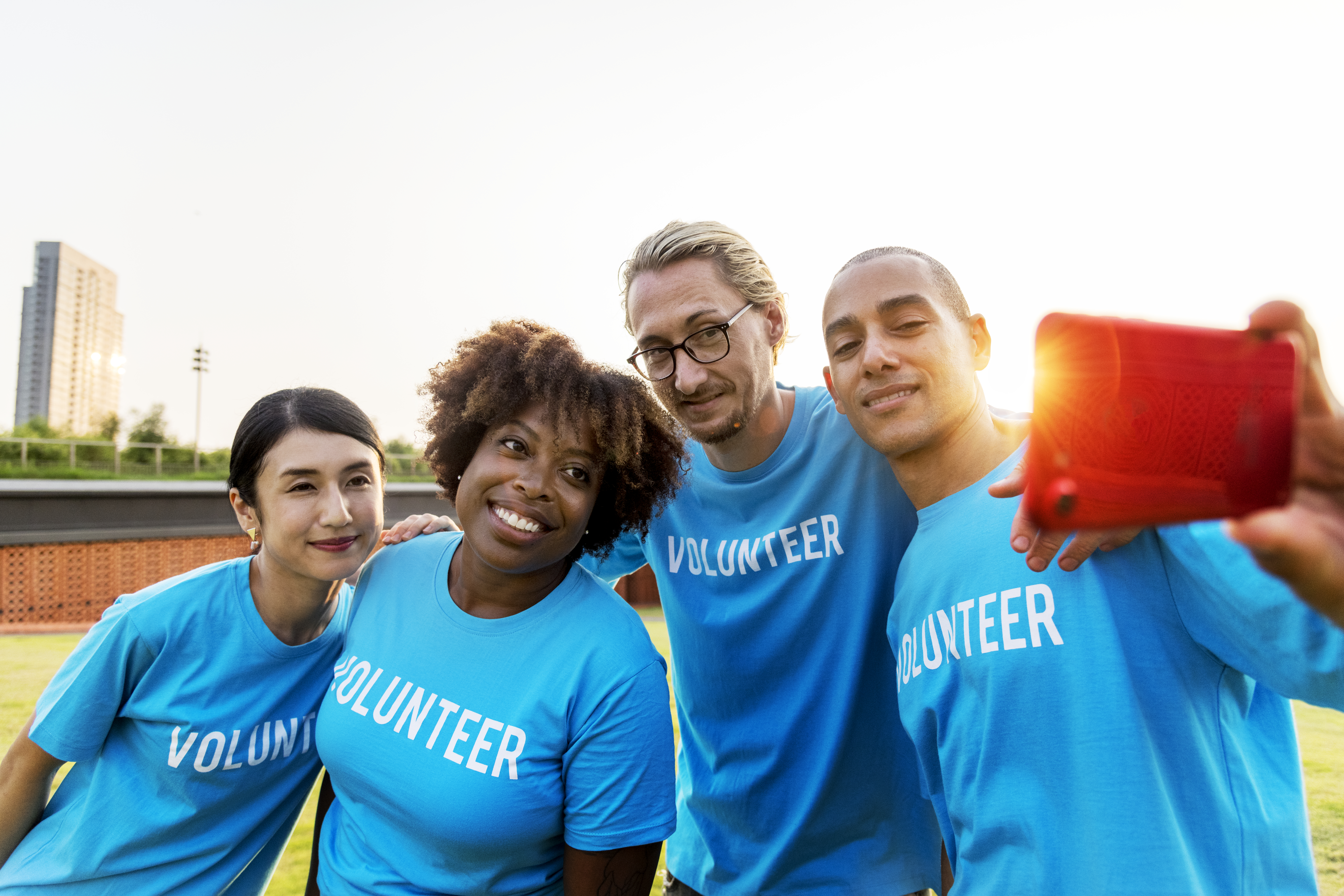 Diverse group of volunteers taking a selfie together